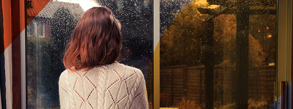 Woman looking out of window