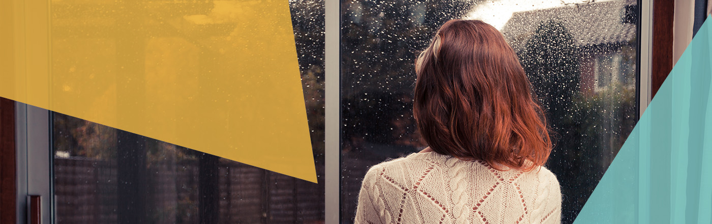 Woman looking out of window