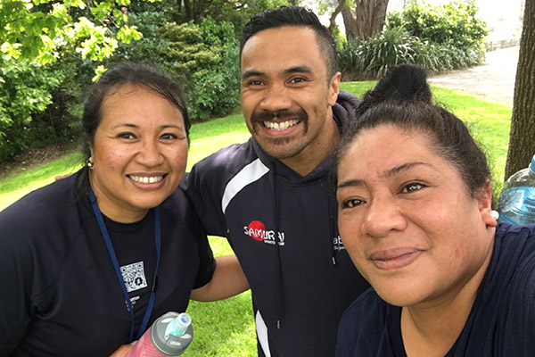 Photo of three Department of Internal Affairs team members in exercise gear