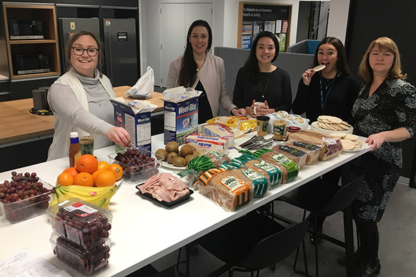 Photo of Department of Internal Affairs team preparing food for shared lunch