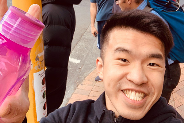 Photo of man holding water bottle