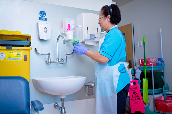 Photo of hospital worker at sink