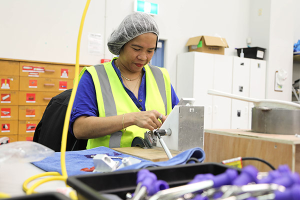 Photo of woman working in Simcro factory