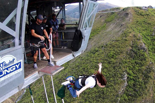 Photo of woman starting bungy jump at AJ Hackett