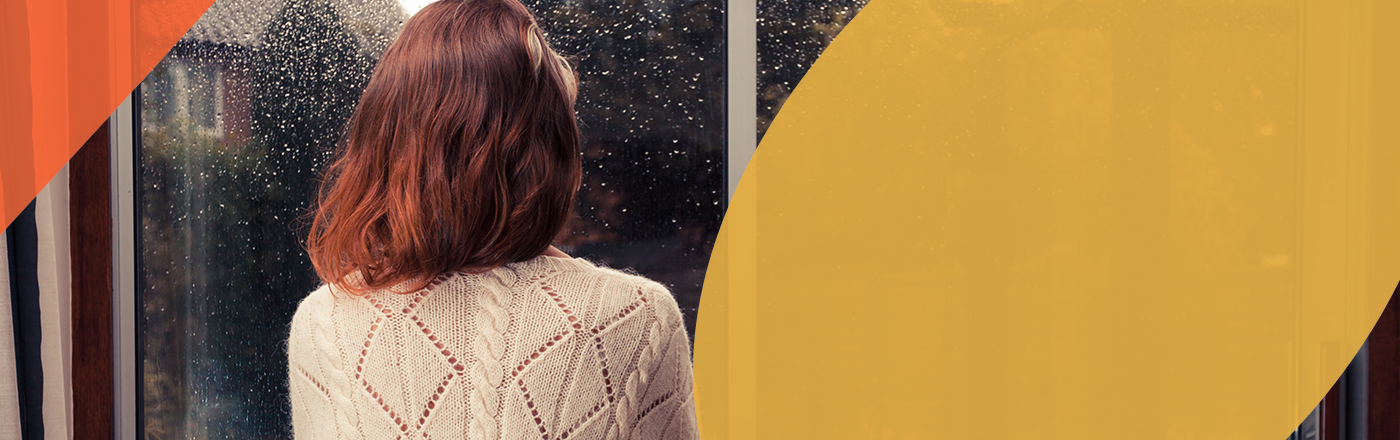 Woman looking out of window
