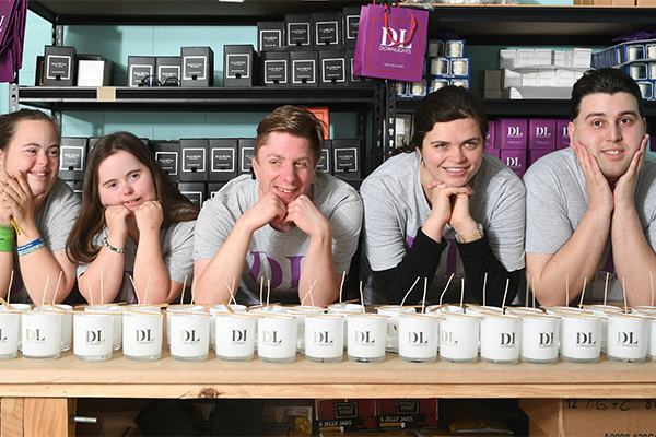 Photo of Downlights candle makers behind line of candles