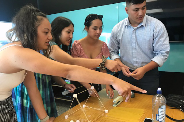 Photo of Polynesian staff building a marshmellow tower