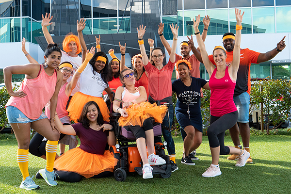 Photo of group of Yellow staff dressed in orange