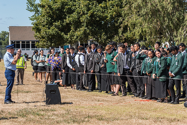 Photo of police officer teaching high school students