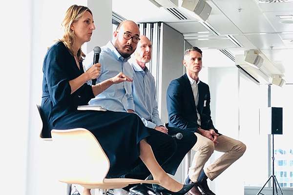 Photo of woman speaking on panel