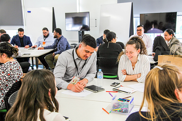 photo of interns working together at desks