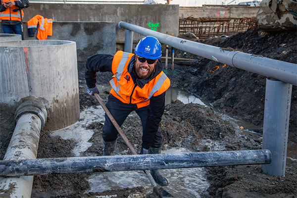 photo of construction worker digging