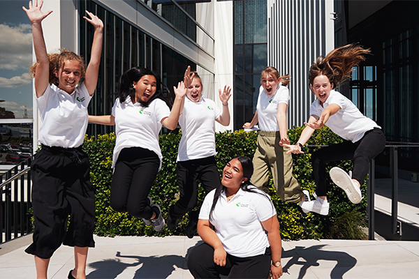 photo of GirlBoss  young women jumping