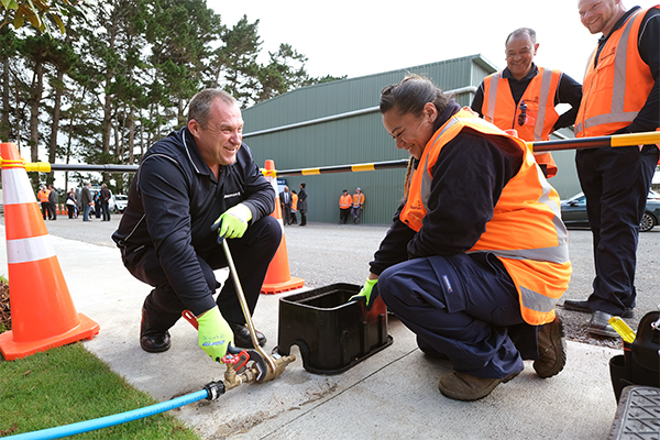 Photo of Watercare workers working on pipe