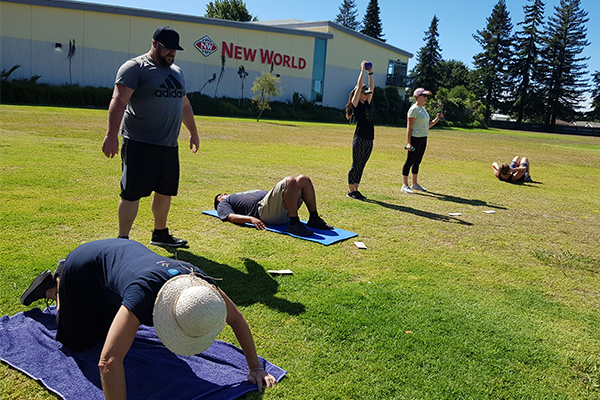 photo of staff doing exercise outdoors