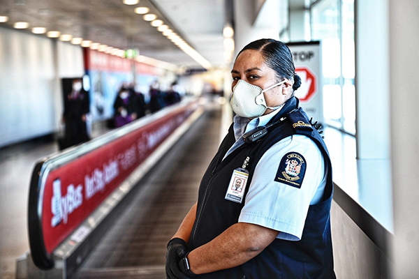 Customs worker wearing mask