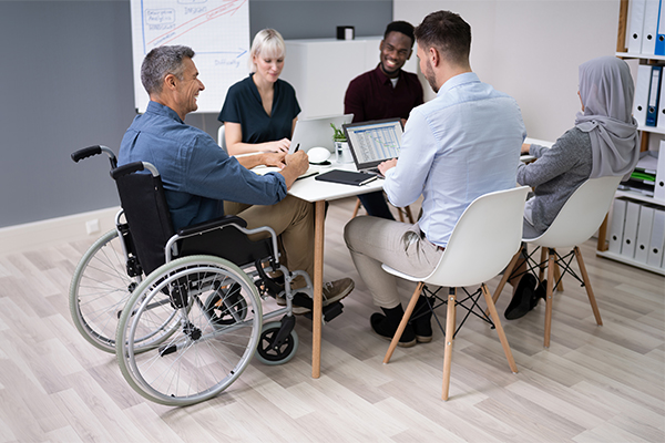 Diverse group of people working together around a table