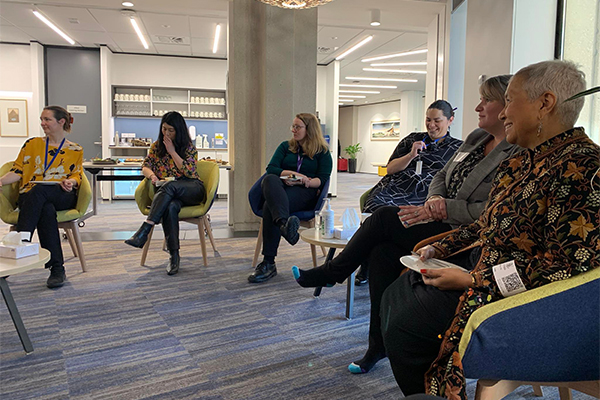 Women sitting in circle in conversation