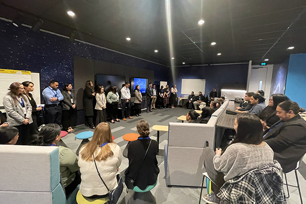 Young corporate workers gathered in circle