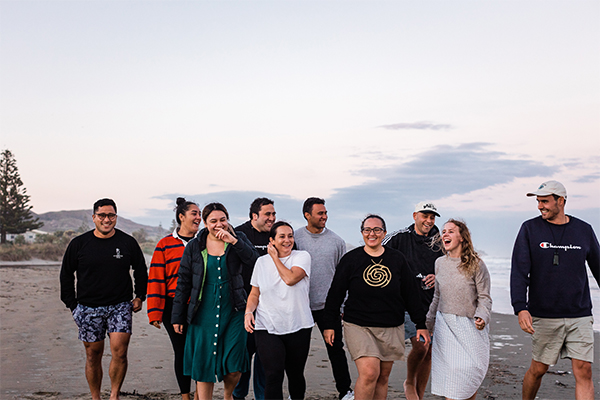 Young people walking on beach