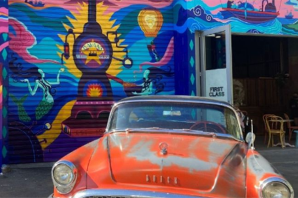 Classic car in front of cafe