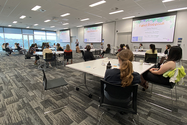 Women sitting at desks taking part in a workshop