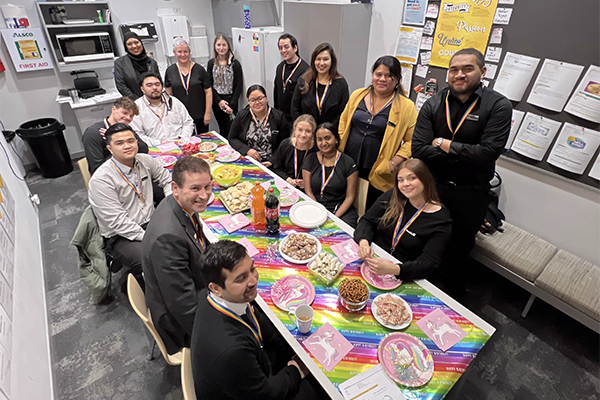 Bank workers sharing rainbow-themed meal