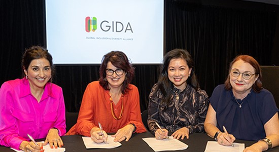 Photo of GIDA partners signing the memorandum of understanding at the launch of the alliance in Auckland.