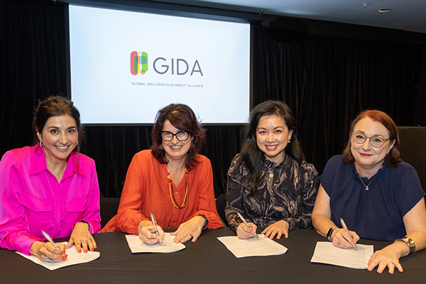 Photo of GIDA partners signing the memorandum of understanding at the launch of the alliance in Auckland.