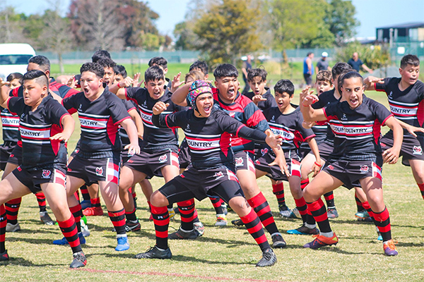 Young rugby team performing a haka