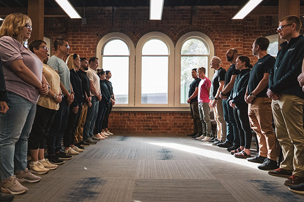 Staff facing each other at Education Perfect headquarters