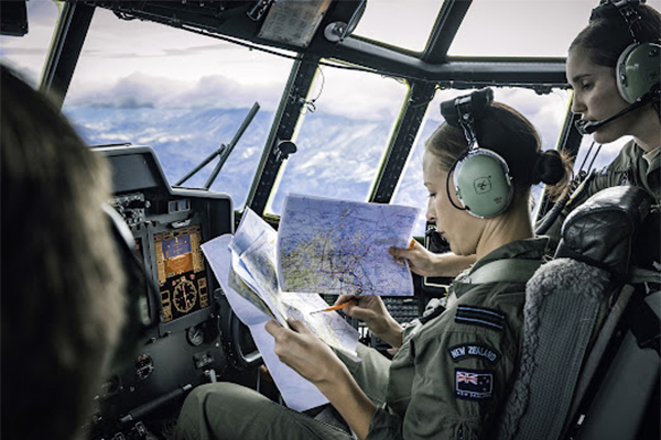 Female soldiers navigating and flying helicopter