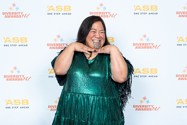 Beautiful woman smiling on red carpet at Diversity Awards NZ 