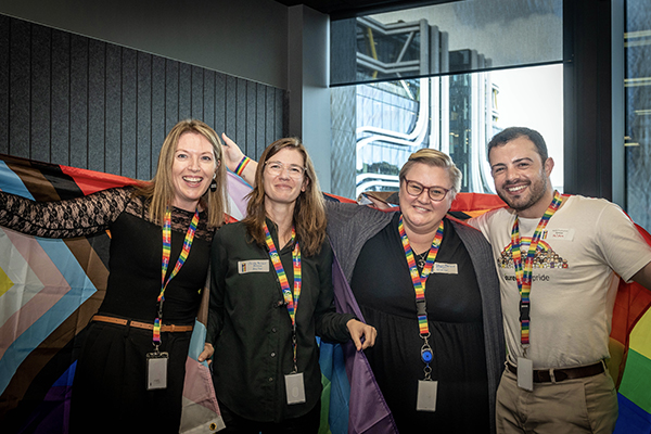 Four Aurecon team members wearing Rainbow lanyards