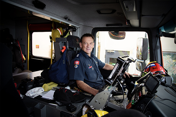 Firefighter driving a fire engine